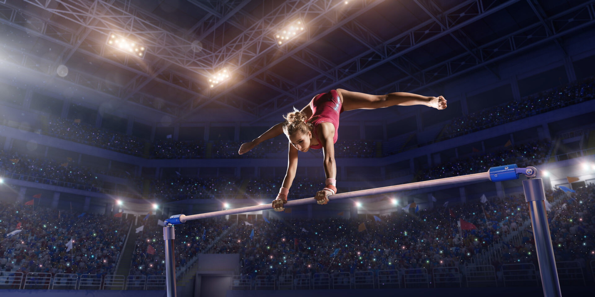 Female athlete doing a complicated exciting trick on horizontal gymnastics bars in a professional gym. Girl perform stunt in bright sports clothes