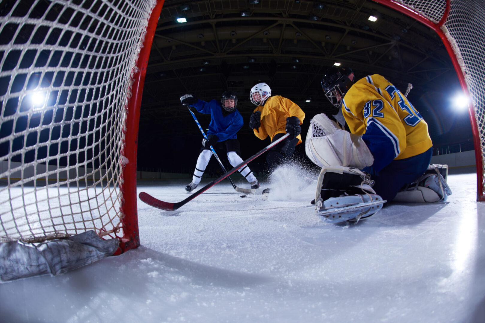 ice hockey goalkeeper  player on goal in action